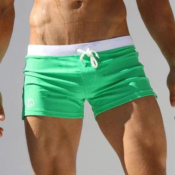 Stylish men's quick-dry swim shorts, great for summer vacations & poolside, includes a secure zip pocket.