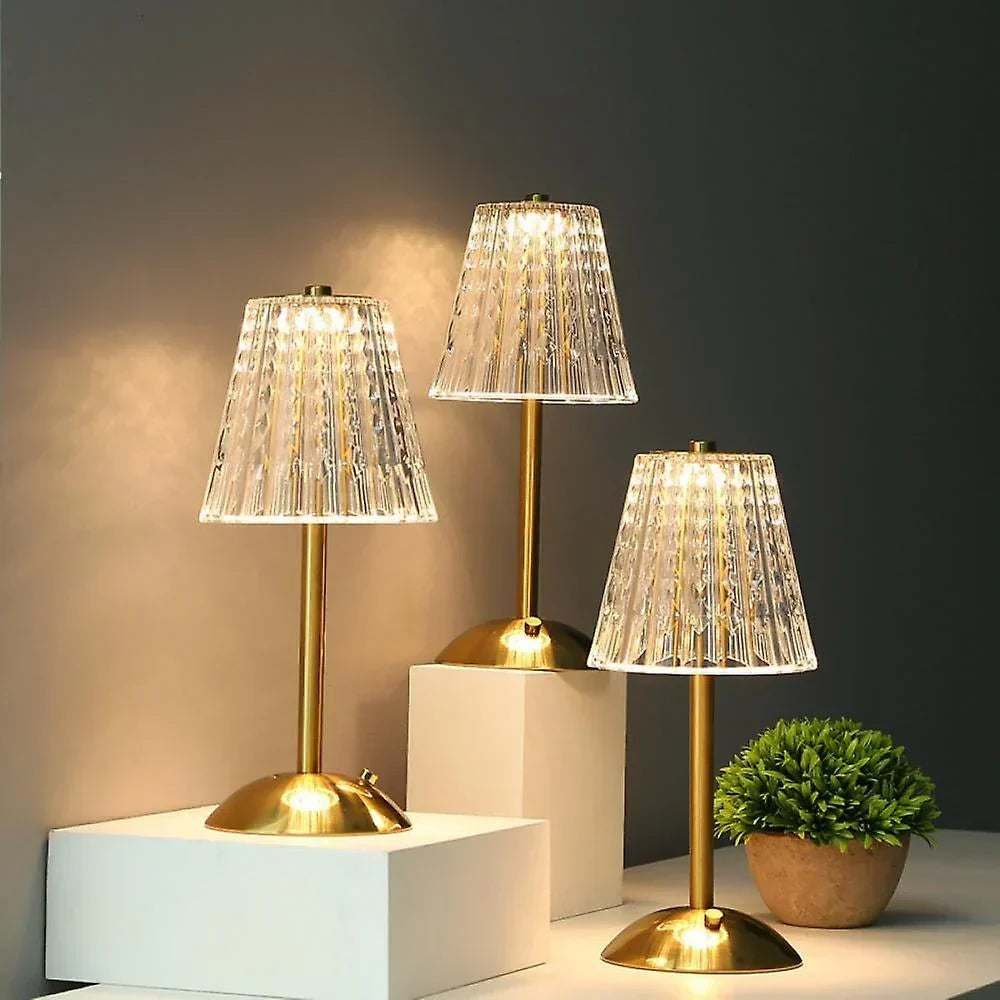 Modern crystal LED table lamp, touch-controlled, featuring a sophisticated gold base.