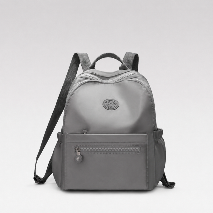 Small nylon mini backpack, compact everyday carry solution for essentials. Lightweight & versatile.
