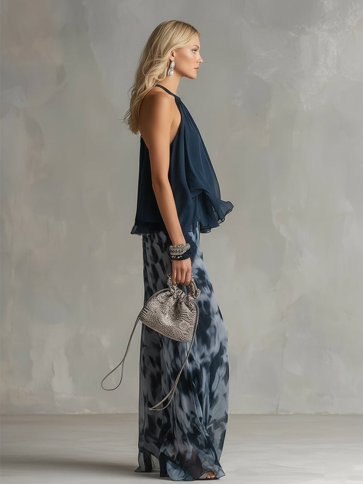 Comfortable navy blue two-piece set: halter neck top and flowy wide leg pants for summer outfits.
