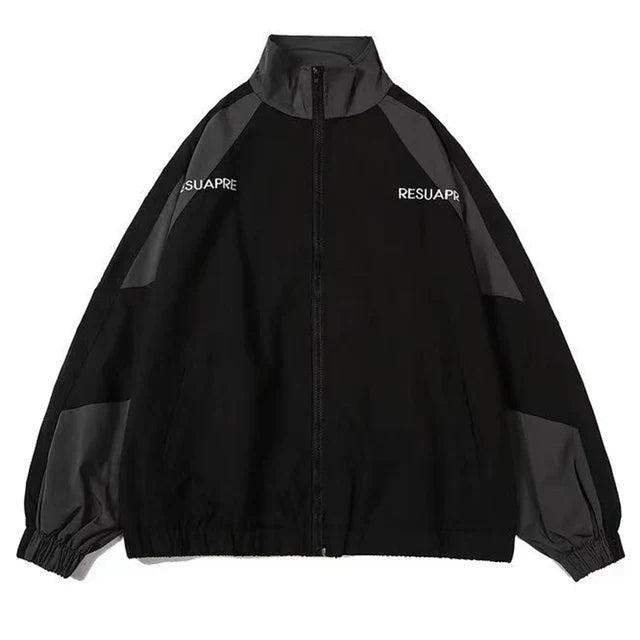 Lightweight women's color-block windbreaker jacket, designed for outdoor wear, offering protection from wind.