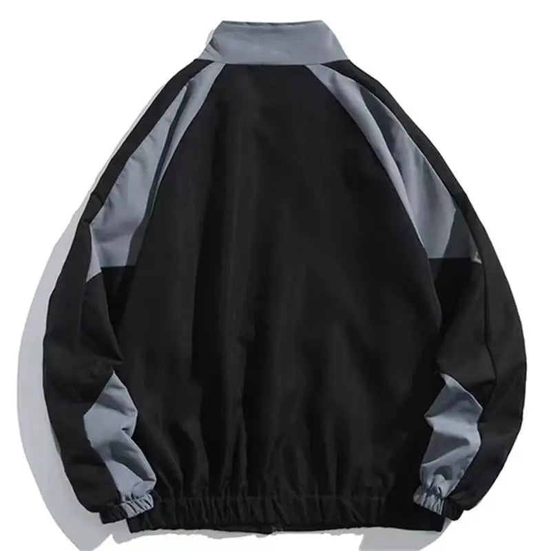 Unisex Aria color block windbreaker providing versatile, lightweight protection for active spring and fall days.