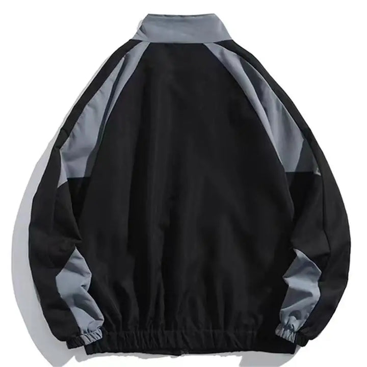 Unisex Aria color block windbreaker providing versatile, lightweight protection for active spring and fall days.