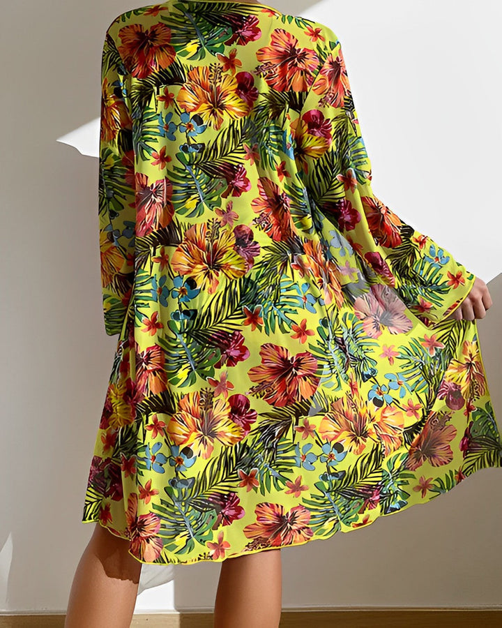 Chic women's tropical print 3-piece swimwear set with bikini and cover-up for resort and vacation wear.