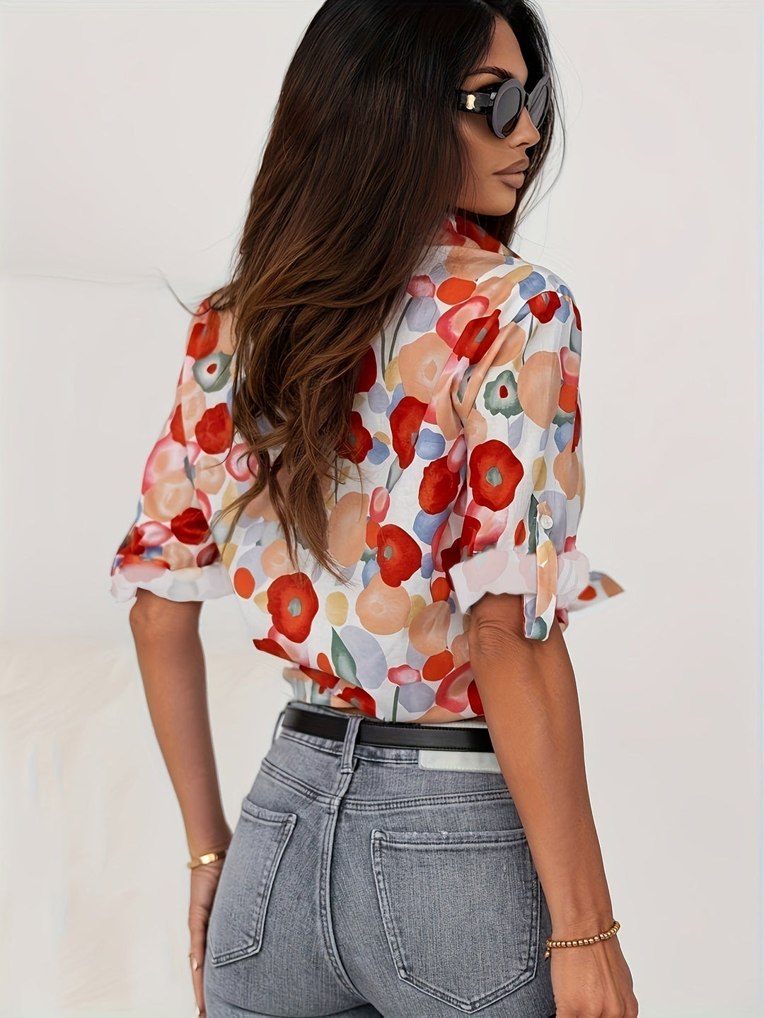 Women's vibrant poppy floral long sleeve button-up blouse. A chic and colorful patterned shirt for spring/summer.