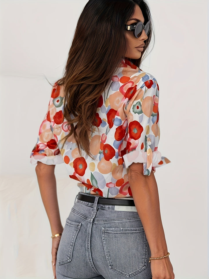 Women's vibrant poppy floral long sleeve button-up blouse. A chic and colorful patterned shirt for spring/summer.