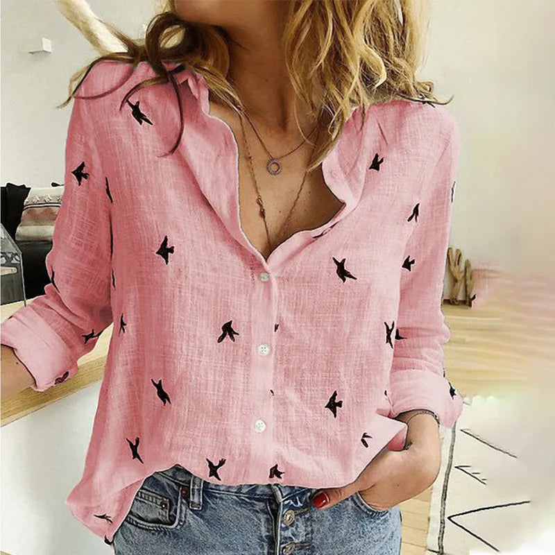 Fashionable women's bird print blouse. Long sleeve, button-up, relaxed fit for summer.