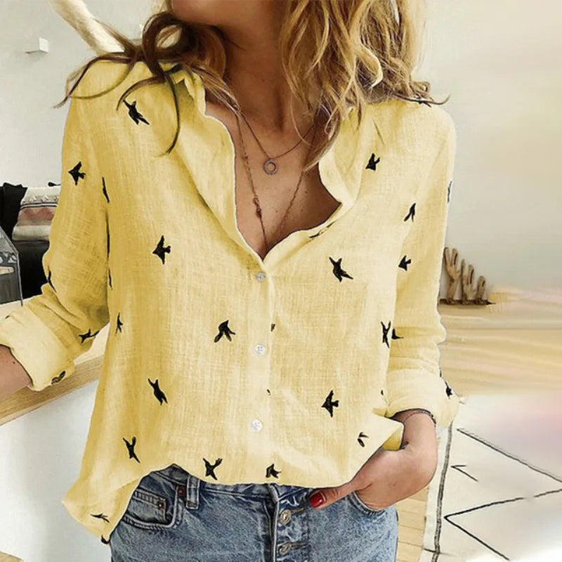 Elegant women's button-up blouse with all-over bird print. Long sleeve, perfect for office.