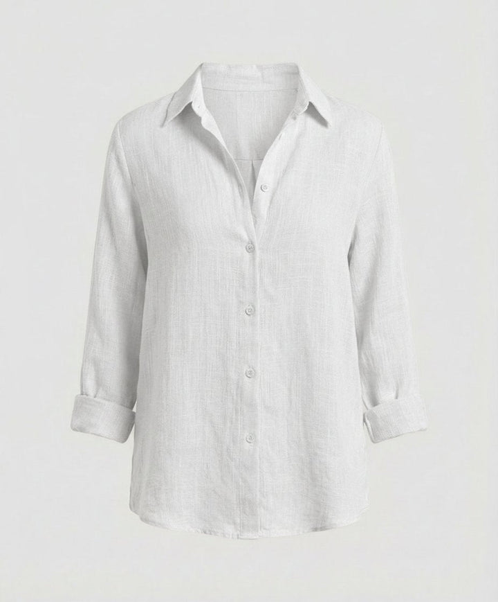 Effortless women's button-up top, long-sleeve relaxed fit, great for versatile layering and everyday style.