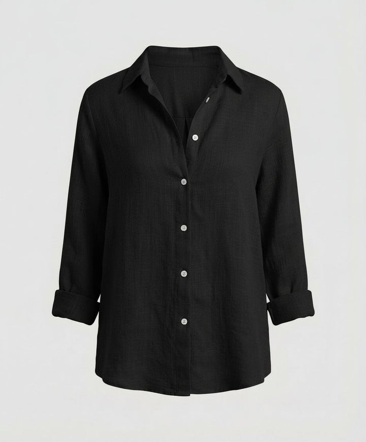 Elegant women's button-up shirt, relaxed long-sleeve fit, a versatile top for office and casual occasions.