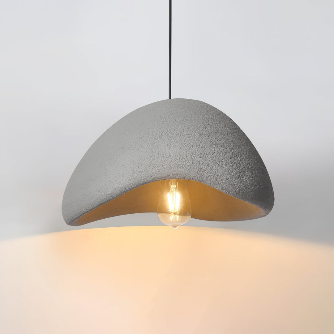 Elegant Wabi-Sabi cocoon pendant lamp. A designer light fixture for organic modern and minimalist living spaces.