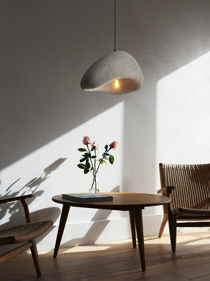 Minimalist Wabi-Sabi cocoon pendant light. Organic modern ceiling fixture offering a soft, warm glow.