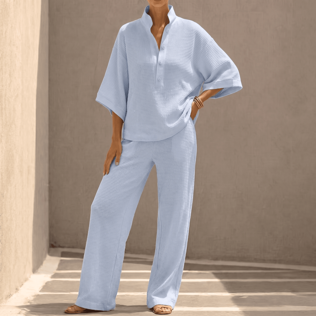 Women's effortless waffle knit two-piece set with dolman sleeves, perfect for casual spring comfort.