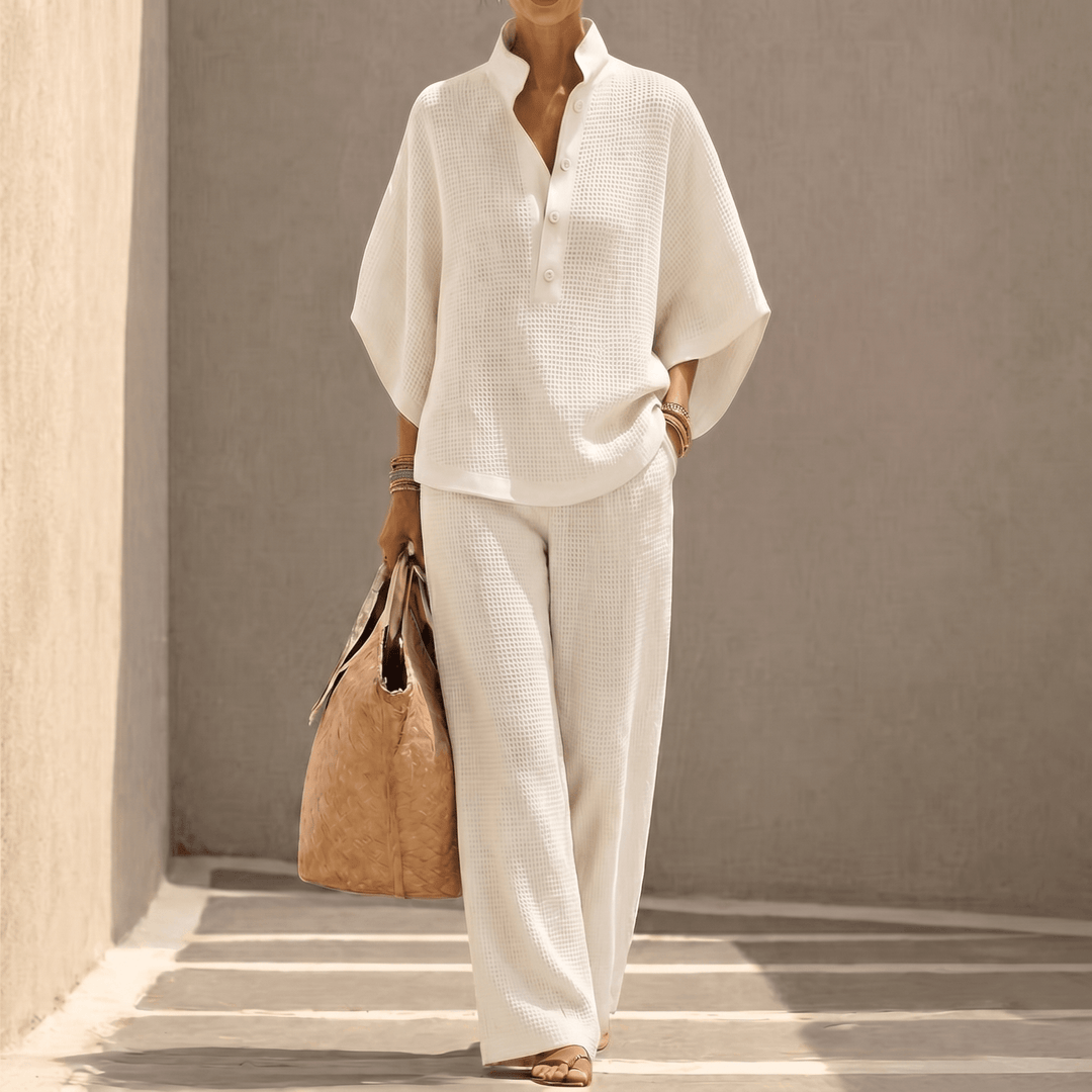 Comfortable women's loungewear set: waffle knit top with dolman sleeves & matching pants for relaxing.