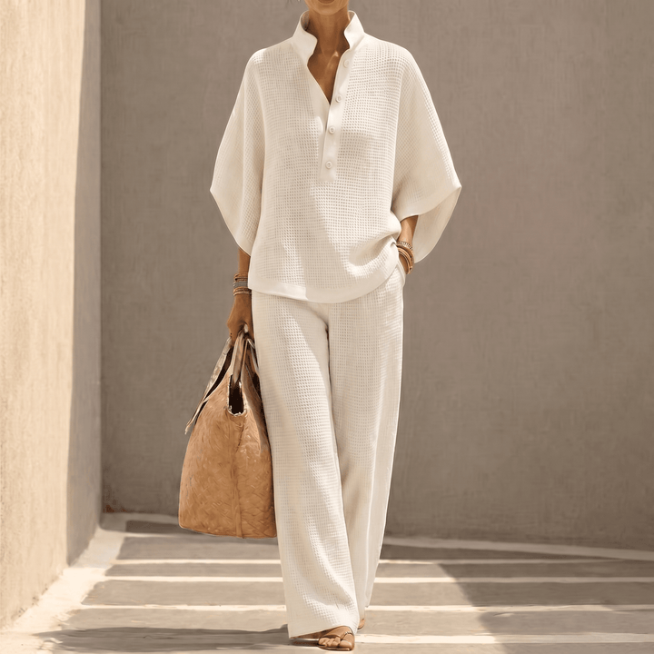 Comfortable women's loungewear set: waffle knit top with dolman sleeves & matching pants for relaxing.