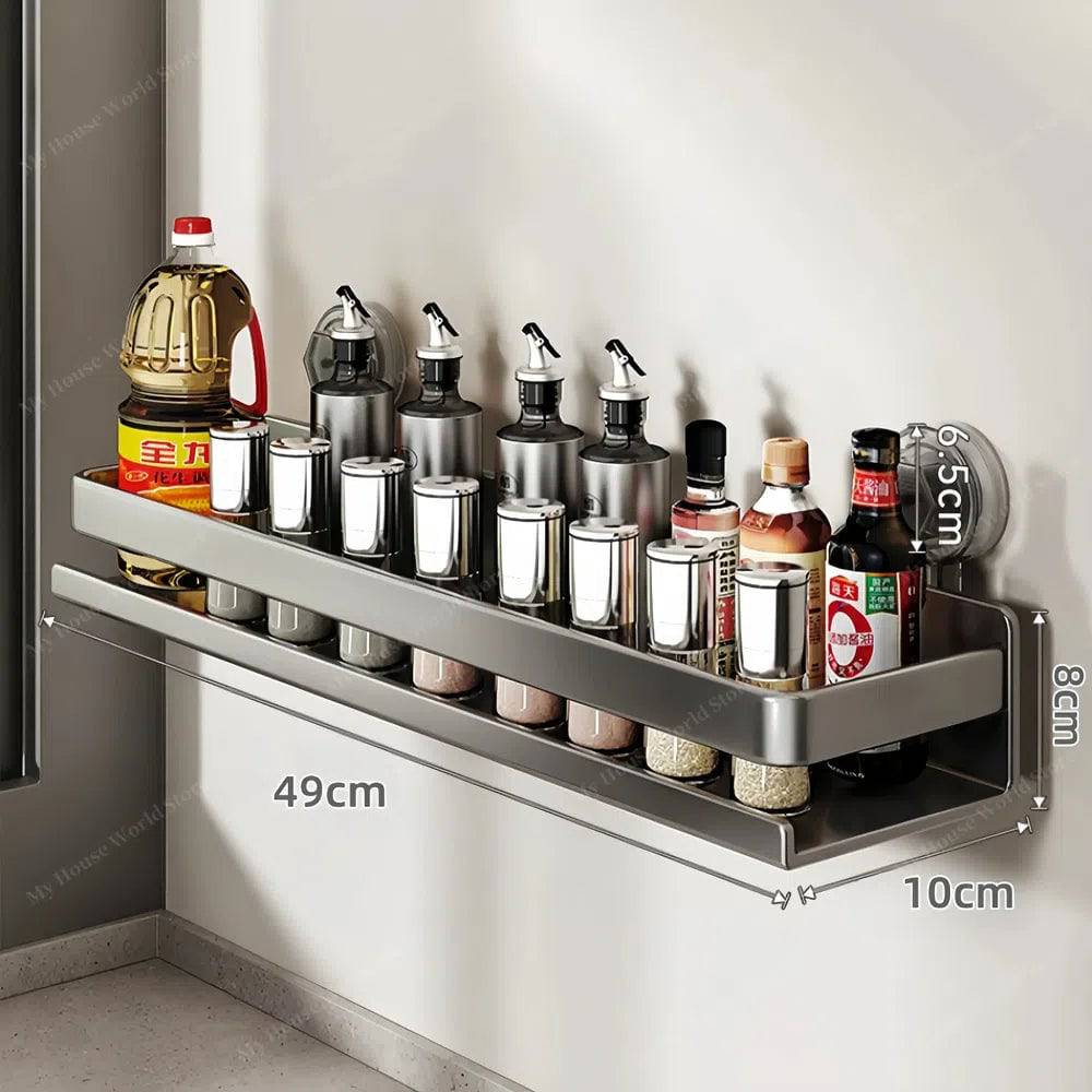 Stainless steel wall mounted spice rack, secured with powerful suction cups for easy kitchen storage.