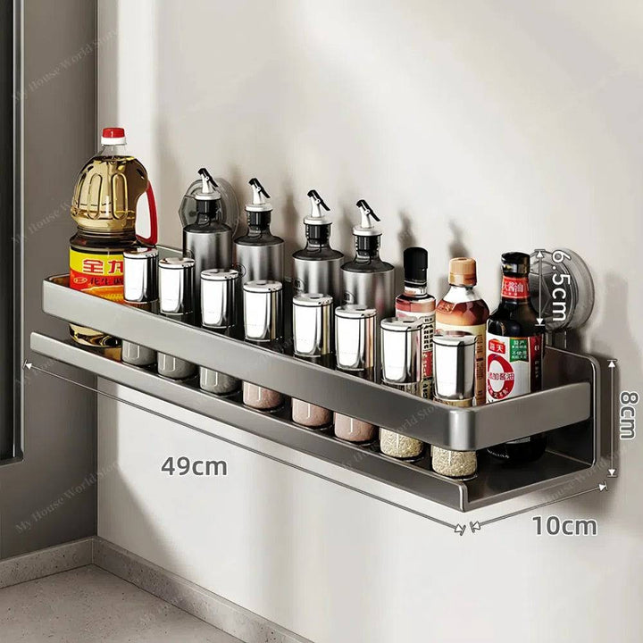 Stainless steel wall mounted spice rack, secured with powerful suction cups for easy kitchen storage.