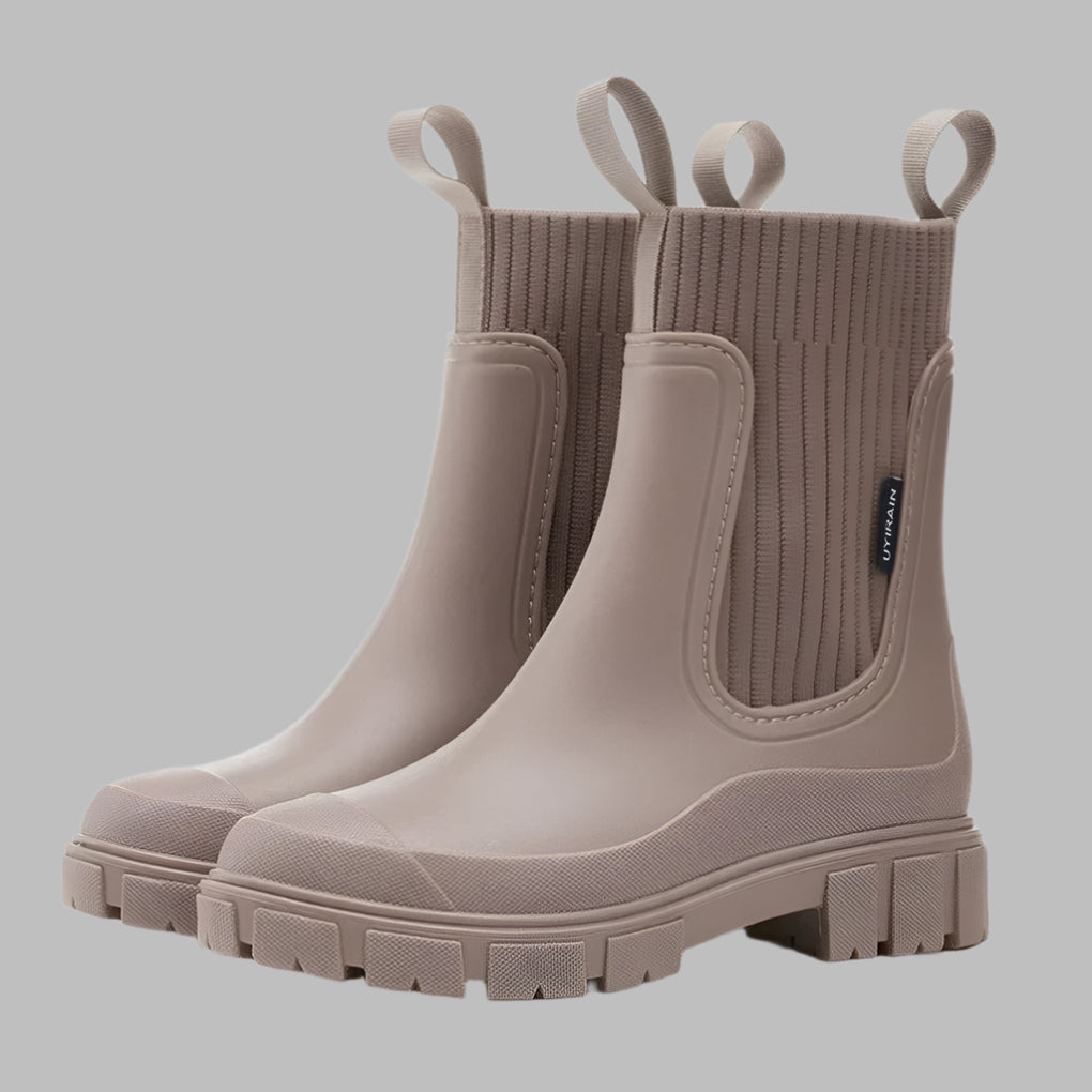 Waterproof Chelsea boots for women, stylish all-weather footwear for rain.