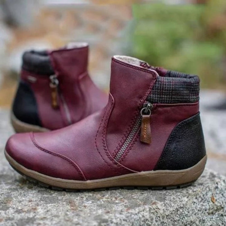 Durable waterproof women's ankle boots, orthopedic support & easy zipper, comfortable fall/winter footwear.