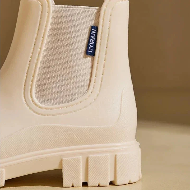 Fashionable women's waterproof Chelsea ankle boots, essential stylish footwear for rainy days & everyday comfort.