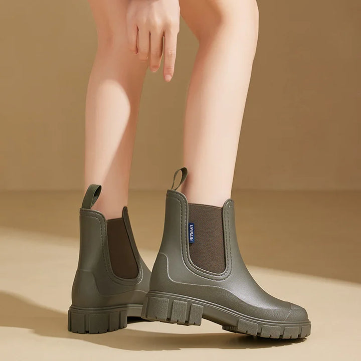 Stylish women's waterproof Chelsea rain boots, comfortable, non-slip, perfect ankle boots for wet weather.