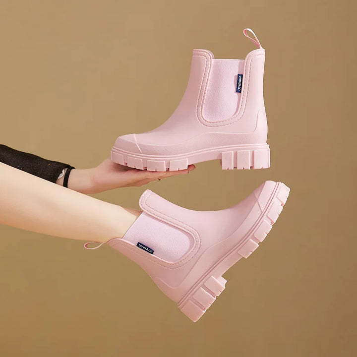 Elegant women's waterproof Chelsea rain boots, ankle height, non-slip sole for maximum wet weather safety.