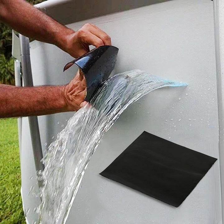 Waterproof self-adhesive repair tape sealing a pipe leak outdoors