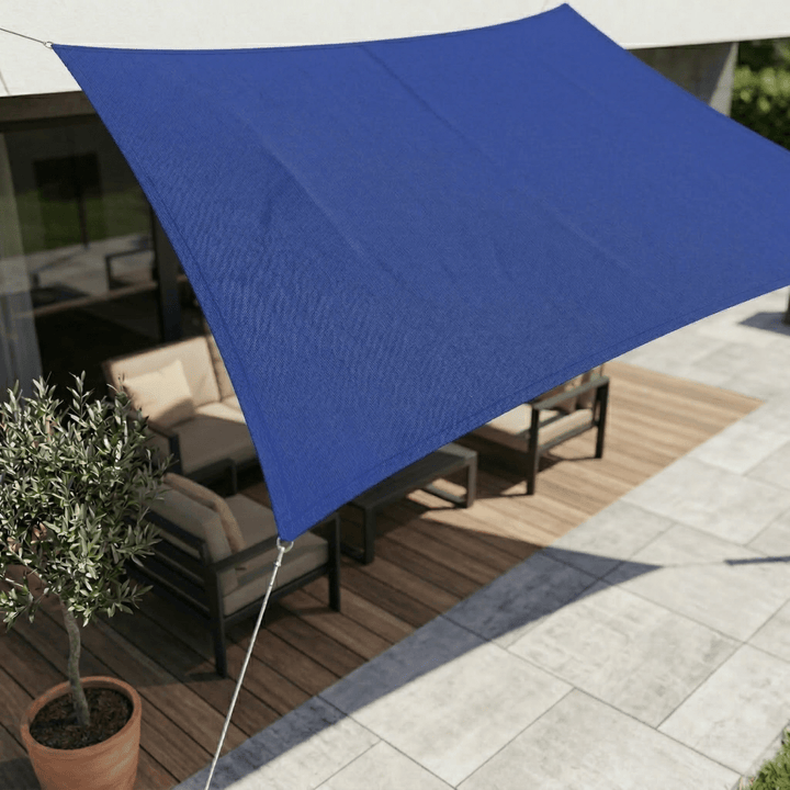 Large sun sail shade offering UV protection for outdoor living areas.