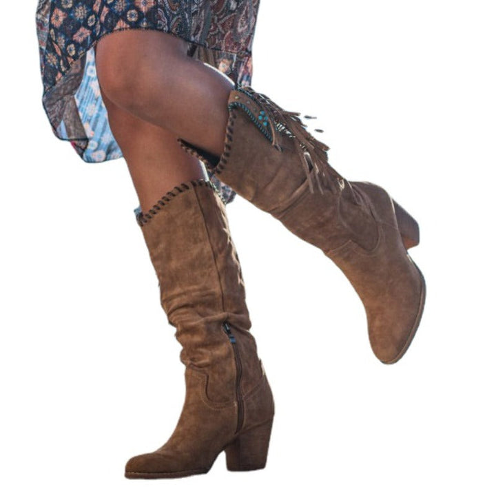 Women's Dakota knee-high western boots. Perfect blend of fashion & comfort with a pointed toe, block heel & studs.