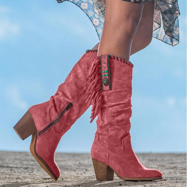 Comfortable women's Dakota western knee-high boots for daily wear. Features a stylish pointed toe, block heel & fringe accents.