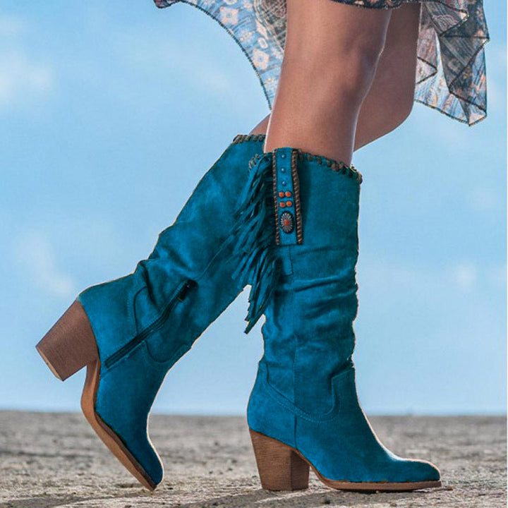 Dakota women's knee-high western fashion boots. Elegant pointed toe, sturdy block heel, unique studded & fringe details.