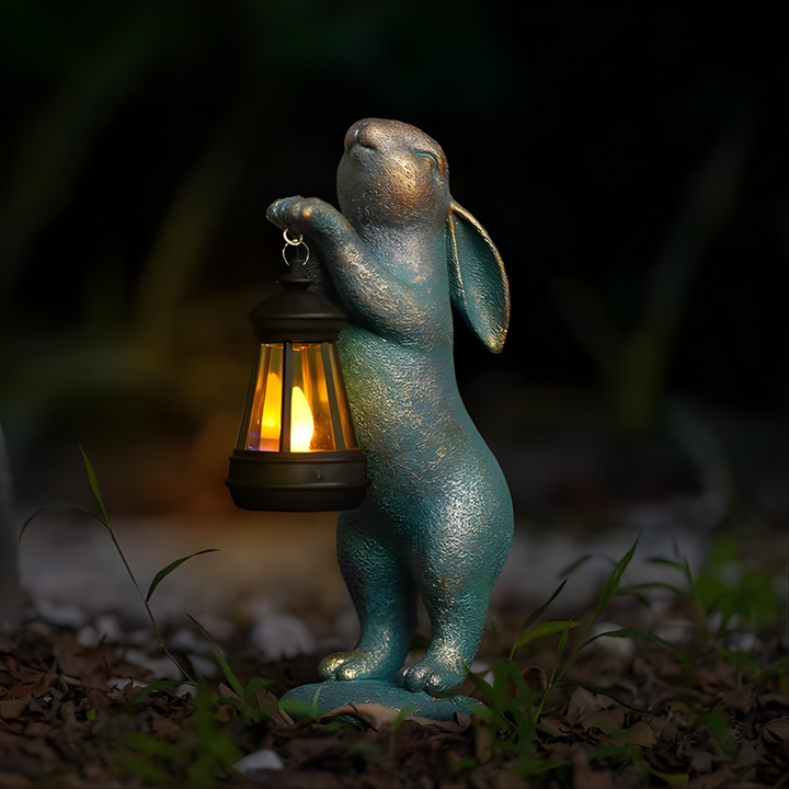 Bronze finish whimsical rabbit garden statue, a lovely outdoor ornament & unique gift for gardeners and home decor.