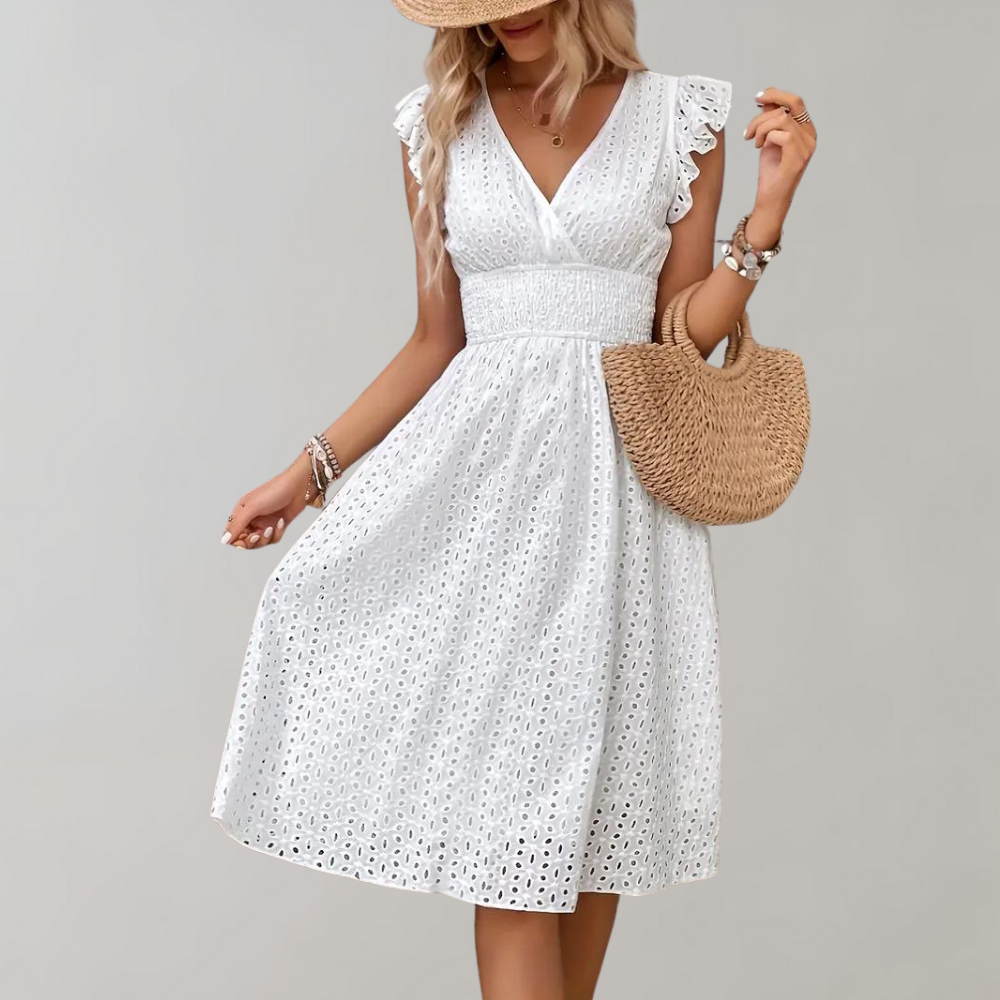 Flowy white women's summer dress featuring charming ruffled sleeves, ideal for warm weather days.