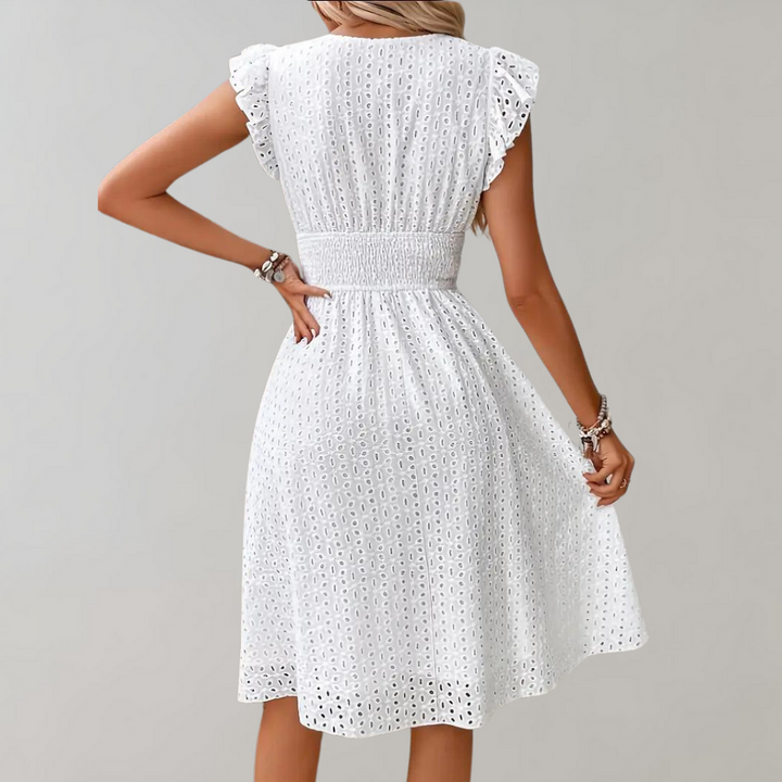 Elegant white ruffled sleeve dress for women, a versatile summer piece for beach, day, or vacation.