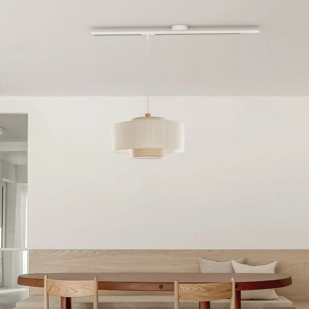 Modern adjustable ceiling light rail. White pendant system for flexible home lighting.