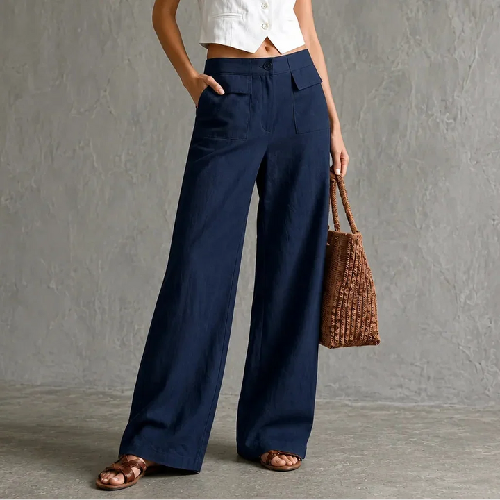 Sophisticated women's high-waist wide-leg dress pants with discreet pockets, flattering and modern.