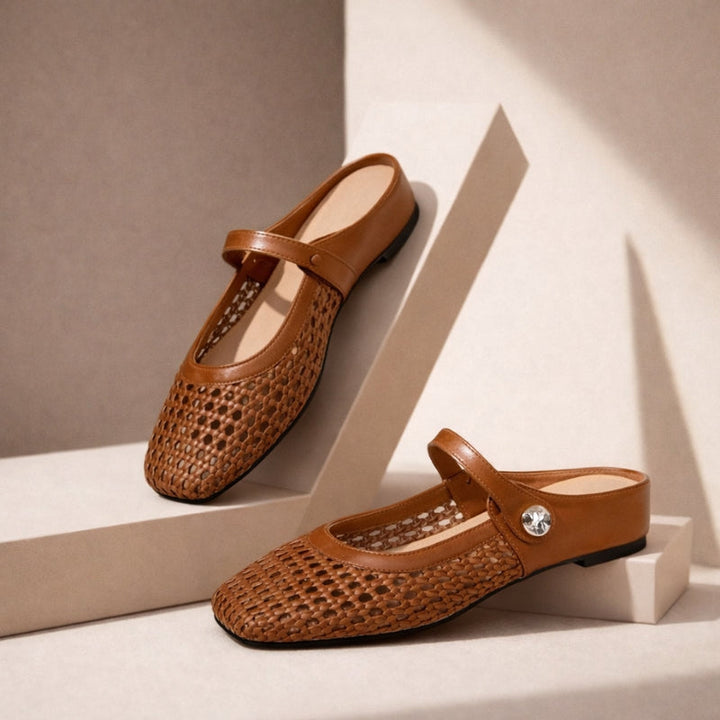 Classic black woven Mary Jane flat mules, sophisticated slip-on women's shoes for smart casual comfort.