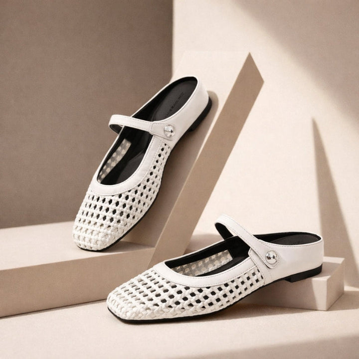 White woven Mary Jane flat mules, comfortable and stylish women's slip-on shoes for smart casual spring outfits.