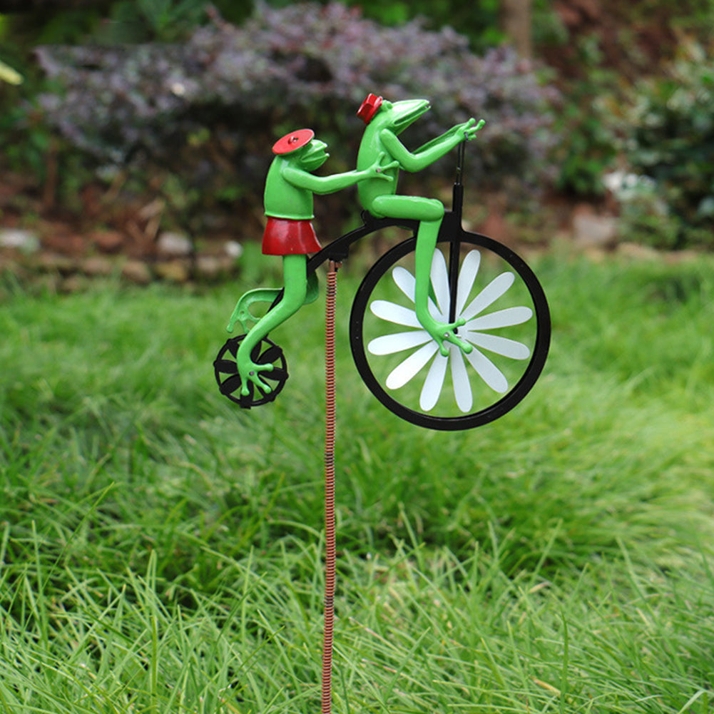 Whimsical garden windmill spinner. Stainless steel kinetic sculpture, perfect lawn ornament for yard art & patio decor.