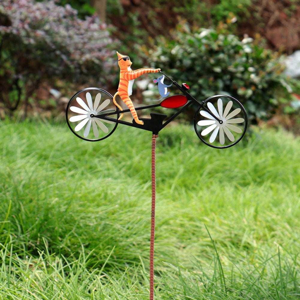 Kinetic whimsical garden windmill spinner. Durable stainless steel outdoor decoration for yard art & lawn ornament.