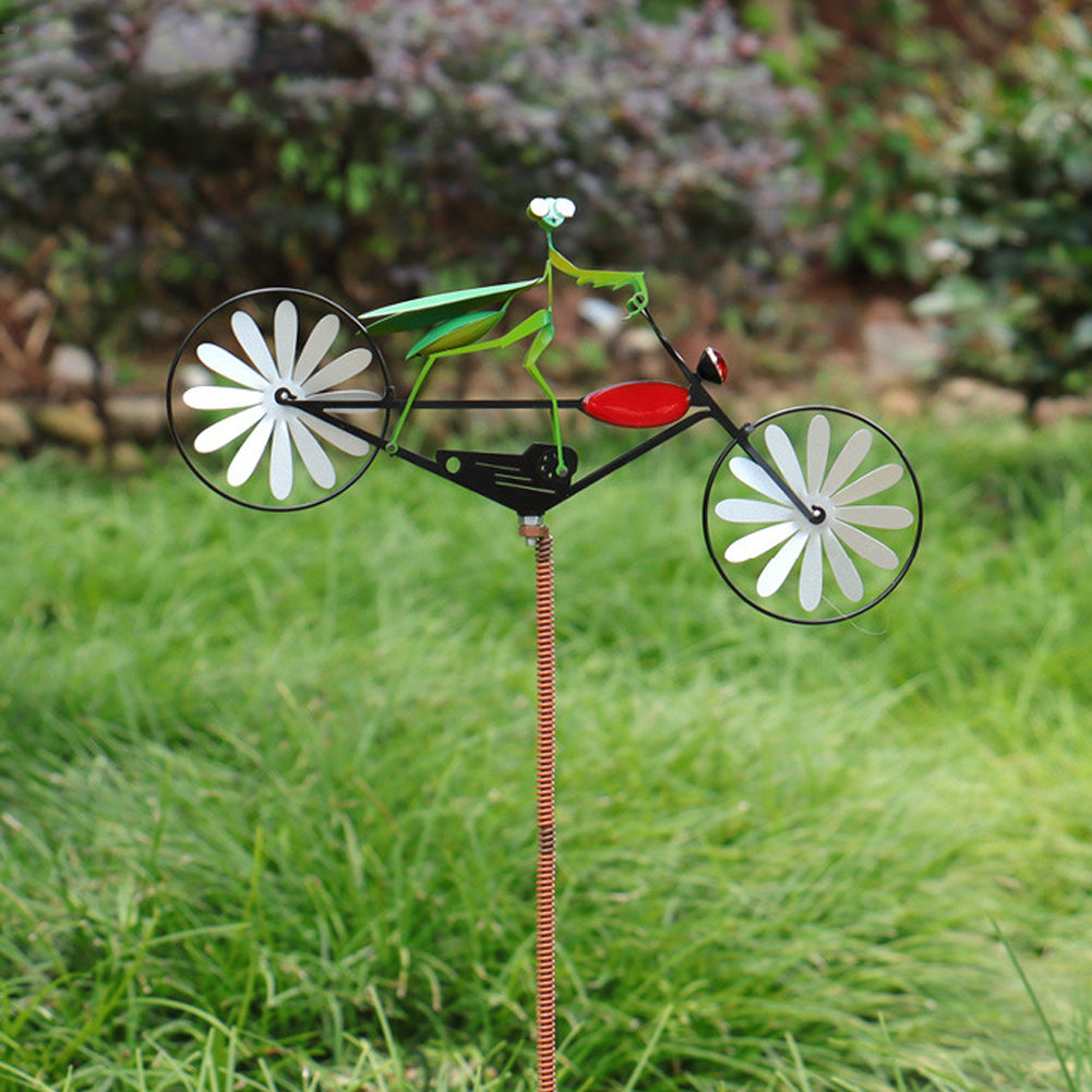 Whimsical animal windmill spinner. Stainless steel kinetic garden decor for outdoor yard art and patio accent.