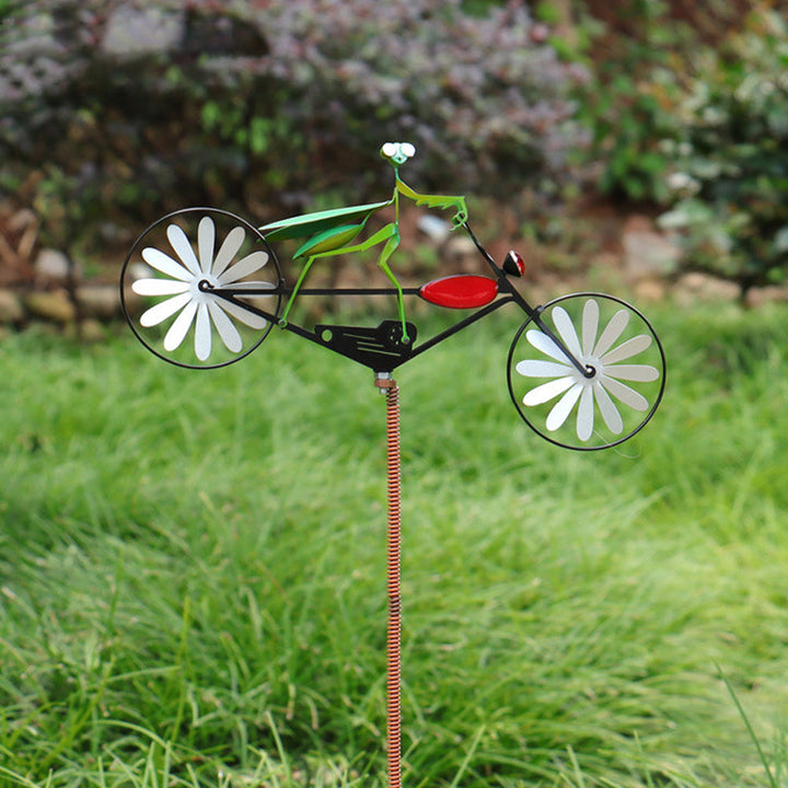 Whimsical animal windmill spinner. Stainless steel kinetic garden decor for outdoor yard art and patio accent.