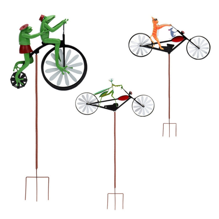 Spinning whimsical garden windmill decor. Stainless steel kinetic outdoor spinner, vibrant yard art & lawn ornament.