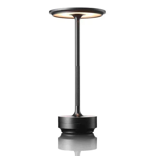 Stylish silver wireless lamp, perfect as a bedside or accent light. Dimmable & portable.
