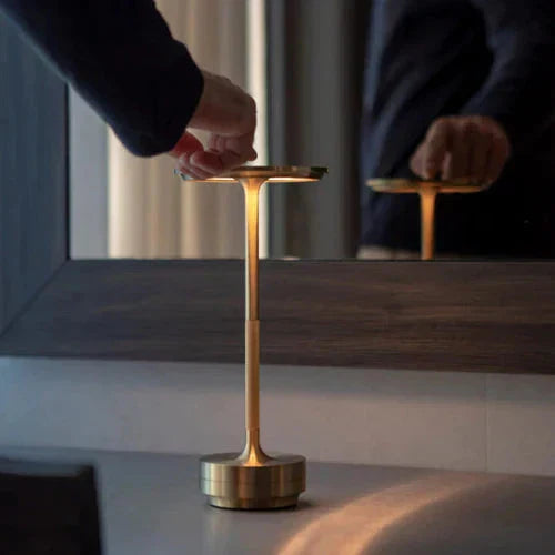GlowBeam portable table lamp, wireless & dimmable. Enhances modern home decor.