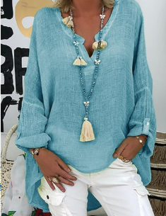 Woman wearing a chic, lightweight oversized blouse. Elegant and comfortable casual wear for effortless style.