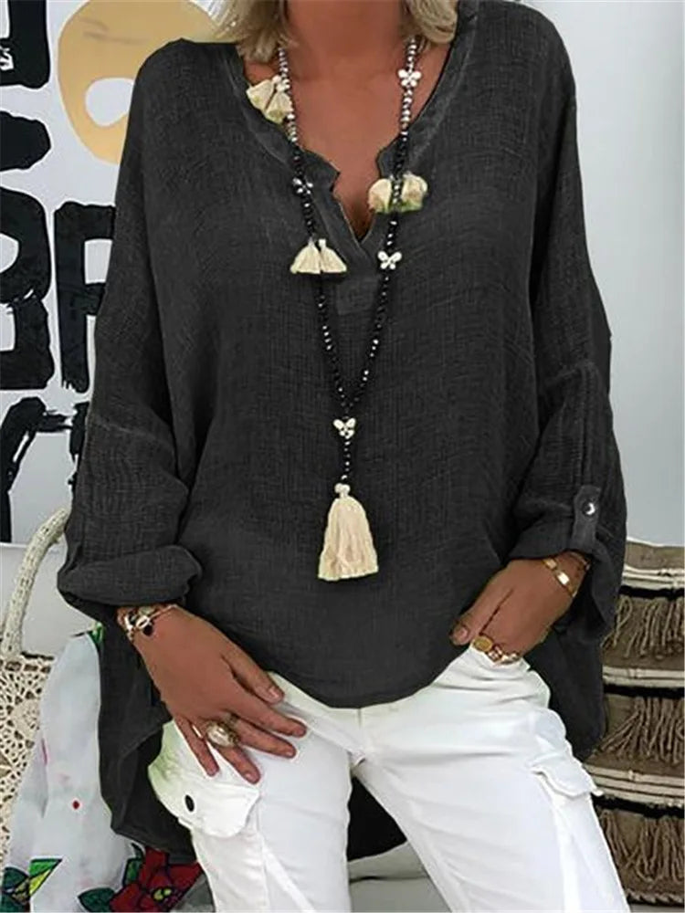 Versatile women's flowy oversized blouse. Chic & comfortable, ideal for casual or elegant plus size styles.