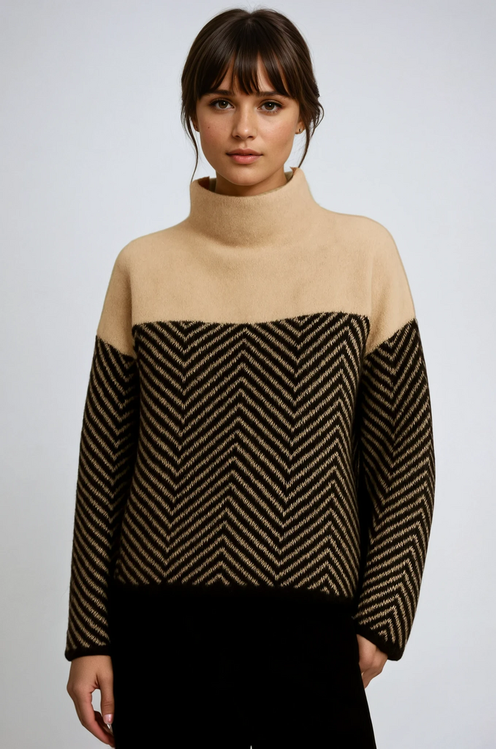Woman wearing a stylish chevron turtleneck sweater, perfect for cozy winter fashion.