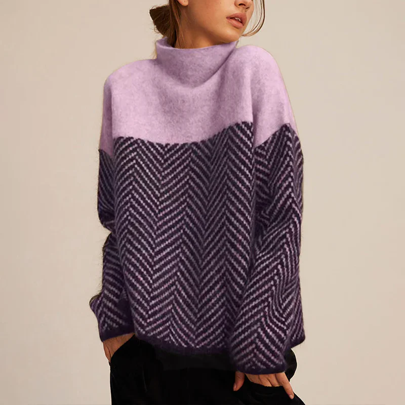 Fashionable women's turtleneck sweater featuring a modern chevron design in warm knitwear.