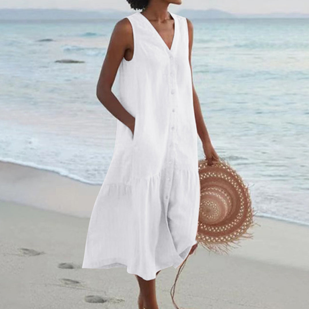 Comfortable & elegant A-line midi dress for women. Sleeveless, V-neck, button-down design with functional pockets.